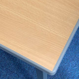 Down view of the corner of a cast PU edged classroom table top